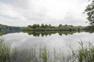 Panorama of a beautiful lake in Flevoland in the Netherlands photo