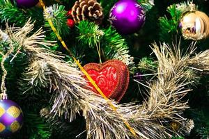 Closeup shot of christmas tree with baubles photo