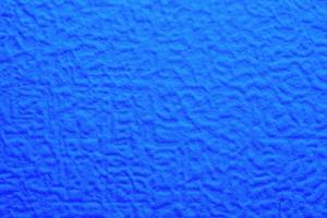 blue foam texture with uneven wavy surface, full frame photo