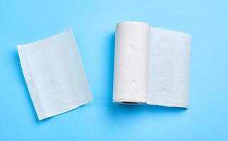 roll of white paper towel on a blue background photo