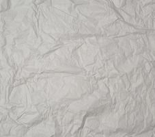 empty gray crumpled sheet of paper, full frame photo