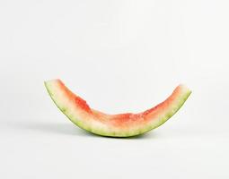 stub of red ripe round watermelon on a white background photo