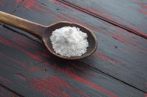 sea salt on wooden spoon photo