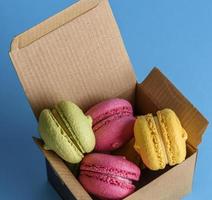 multicolored cakes of almond flour in a brown paper box photo