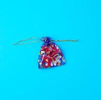 textile bag for gifts on a blue background photo
