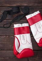 pair of boxing gloves and black bandage photo