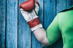 Man's hand in a boxing glove photo