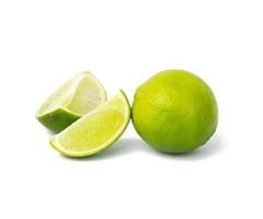 Lime with slice isolated on white background, close up photo