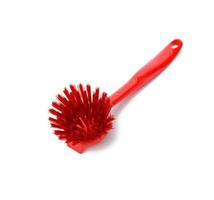 red plastic brush with handle for cleaning isolated on white background photo