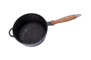 deep old black cast iron frying pan with wooden handle photo