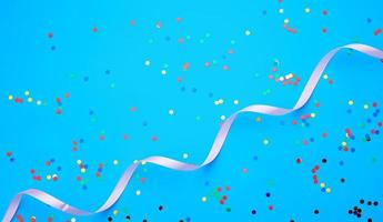 shiny multicolored round confetti scattered on a blue background photo