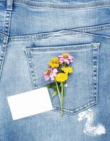 empty white paper card and a bouquet of flowers photo