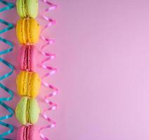 multicolored cakes of almond flour with cream macarons photo