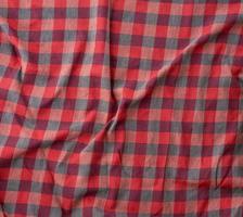 red checkered fabric for sewing various clothes with waves photo