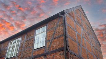 Old roof and half timebered walls on a house photo