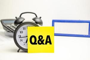 Retro alarm clock and the text Q and A - Questions and Answers photo