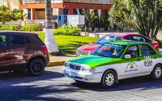 Puerto Escondido Oaxaca Mexico 2023 Green turquoise blue taxi cab car in Puerto Escondido Mexico. photo