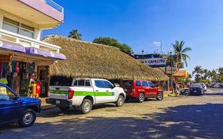 Puerto Escondido Oaxaca Mexico 2022 Scenic view tourist street palm city Zicatela Puerto Escondido Mexico. photo