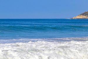 Extremely huge big surfer waves at beach Puerto Escondido Mexico. photo