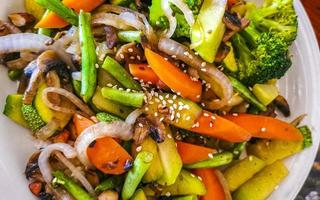 Fried rice and vegetables on white plate Puerto Escondido Mexico. photo