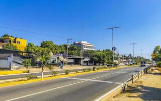 Puerto Escondido Oaxaca Mexico 2022 Busy road street driving cars traffic jam Puerto Escondido Mexico. photo