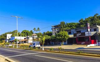 Puerto Escondido Oaxaca Mexico 2022 Busy road street driving cars traffic jam Puerto Escondido Mexico. photo