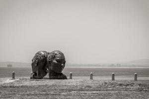 Blue heads statue in Cape Town. Art of south Africa. photo