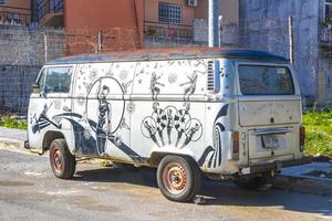 Playa del Carmen Quintana Roo Mexico 2021 Old black broken dirty VW bus Volkswagen car rusting Mexico. photo