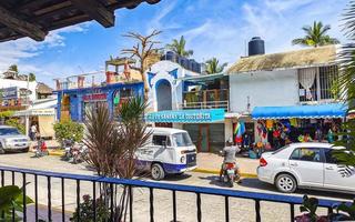 Puerto Escondido Oaxaca Mexico 2022 Scenic view tourist street palm city Zicatela Puerto Escondido Mexico. photo