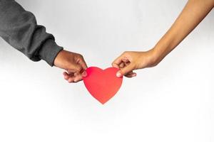 Women and men hands holding hearts together photo