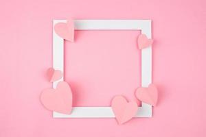 square frame with pink love shape for text copy space. valentine and romantic background design photo