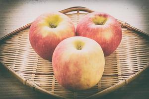 Red apple in basket photo