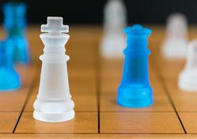 Chess glass on a wood chessboard photo