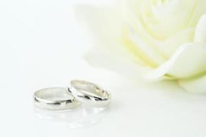 Wedding rings on white background photo