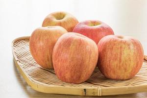 Red apple in basket photo