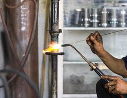 Welders were repairing Shock absorbers photo