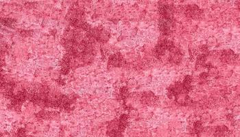 Abstract texture pink red background wall surface toned viva magenta color of the year 2023 copy space selective focus soft focus defocused photo