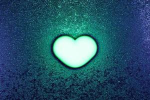 Green neon light heart dark concept photo