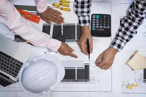 Project contractors and engineers consult on the building construction algorithm. Costs, investment, repairs to residential buildings photo