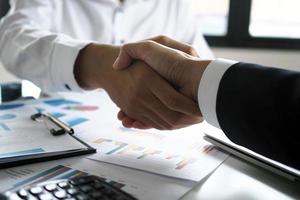 After the meeting well, accepting business cooperation. Successful businessmen handshake. photo