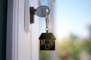 The house key for unlocking a new house is plugged into the door. photo