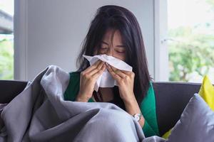 Asian women have high fever and runny nose. sick people concept photo