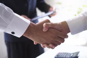 Two executives handshake as partners after the successful meeting. photo