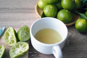 Lime juice made fresh in the glass photo