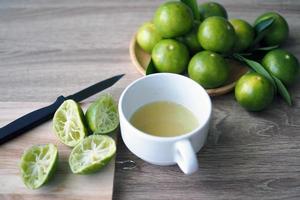 Lime juice made fresh in the glass photo