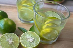 Fresh lime juice made in the glass photo