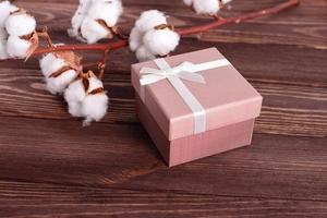Gift box on wooden background, copy space photo