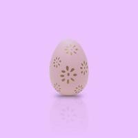 Happy Easter. Beautiful pink egg with different pattern on pink background. photo