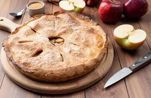 Homemade apple pie with fresh red apples photo