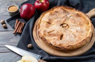 Homemade apple pie with fresh red apples photo